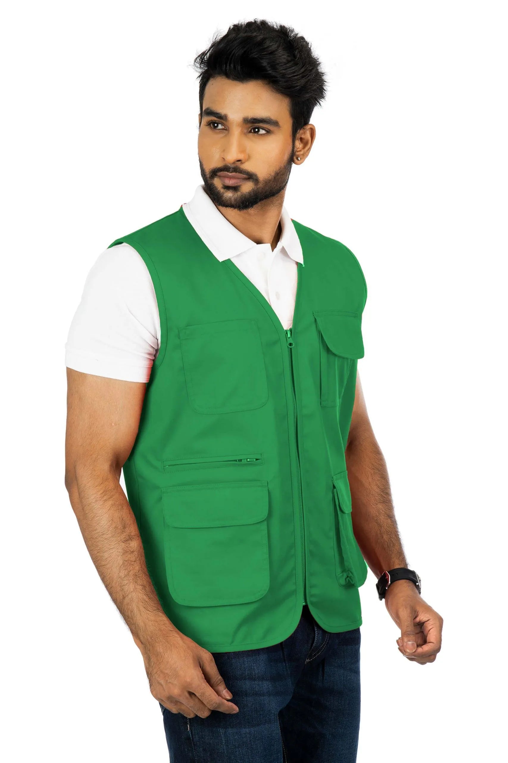 Man wearing corbett green multi-utility safari vest with multiple front pockets over a white polo shirt, front view