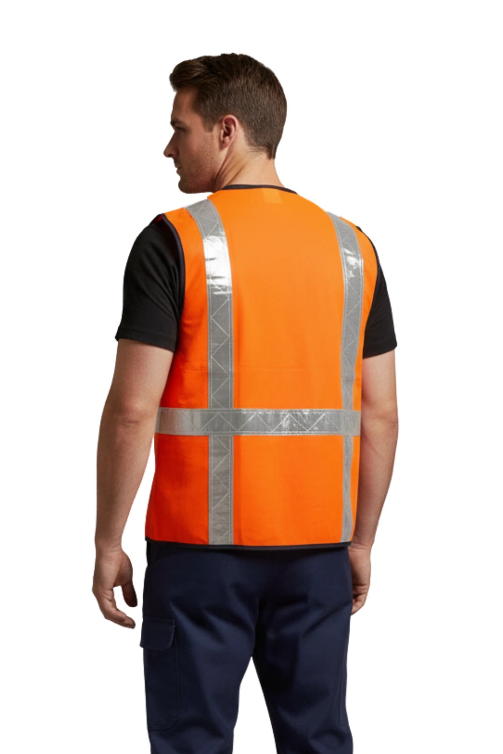 Man wearing bright orange industrial hi-visibility vest with silver reflective tapes on back over black shirt and navy pants