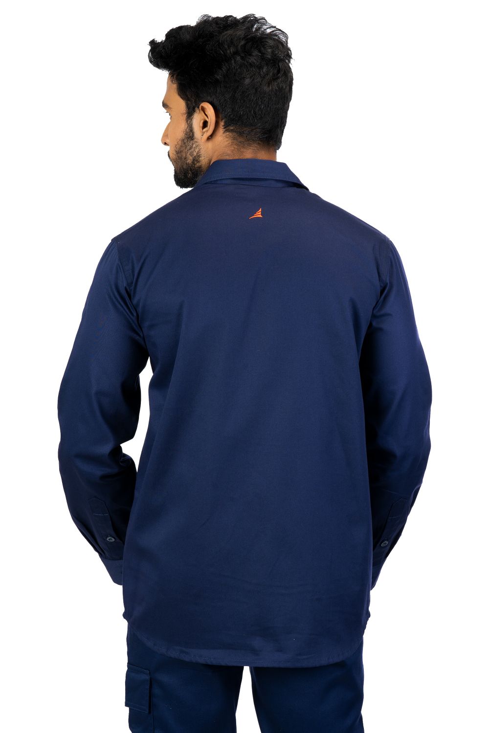 Man wearing navy blue Secura industrial work shirt with long sleeves and small orange logo on upper back, rear view
