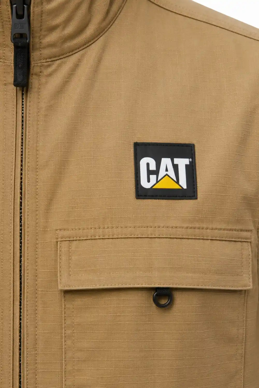 Close-up of a brown jacket with a CAT logo patch on the chest.