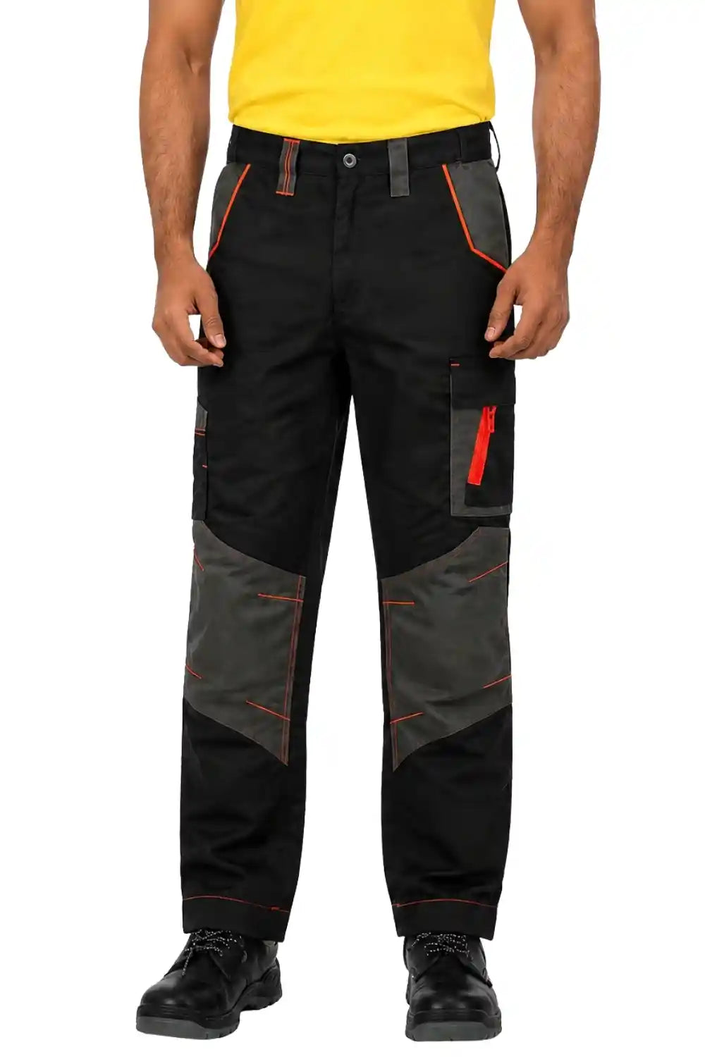 Person wearing black gray Atacama Hammer work pants with orange accents