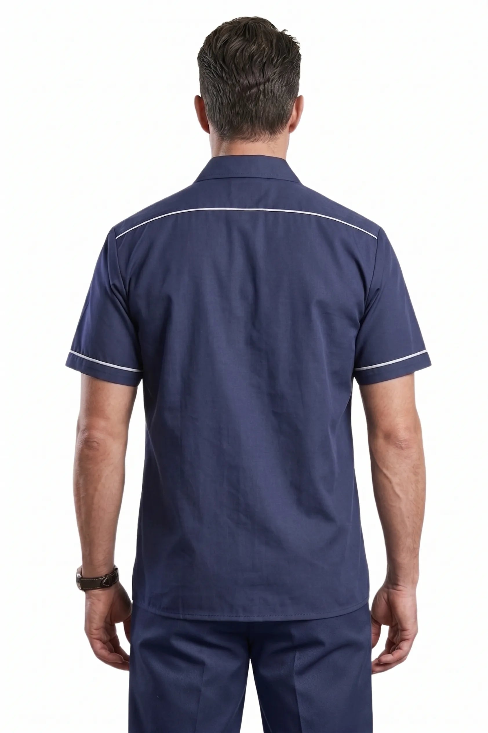 Man wearing navy blue short sleeve workwear shirt with white piping on back yoke and sleeve cuffs, back view