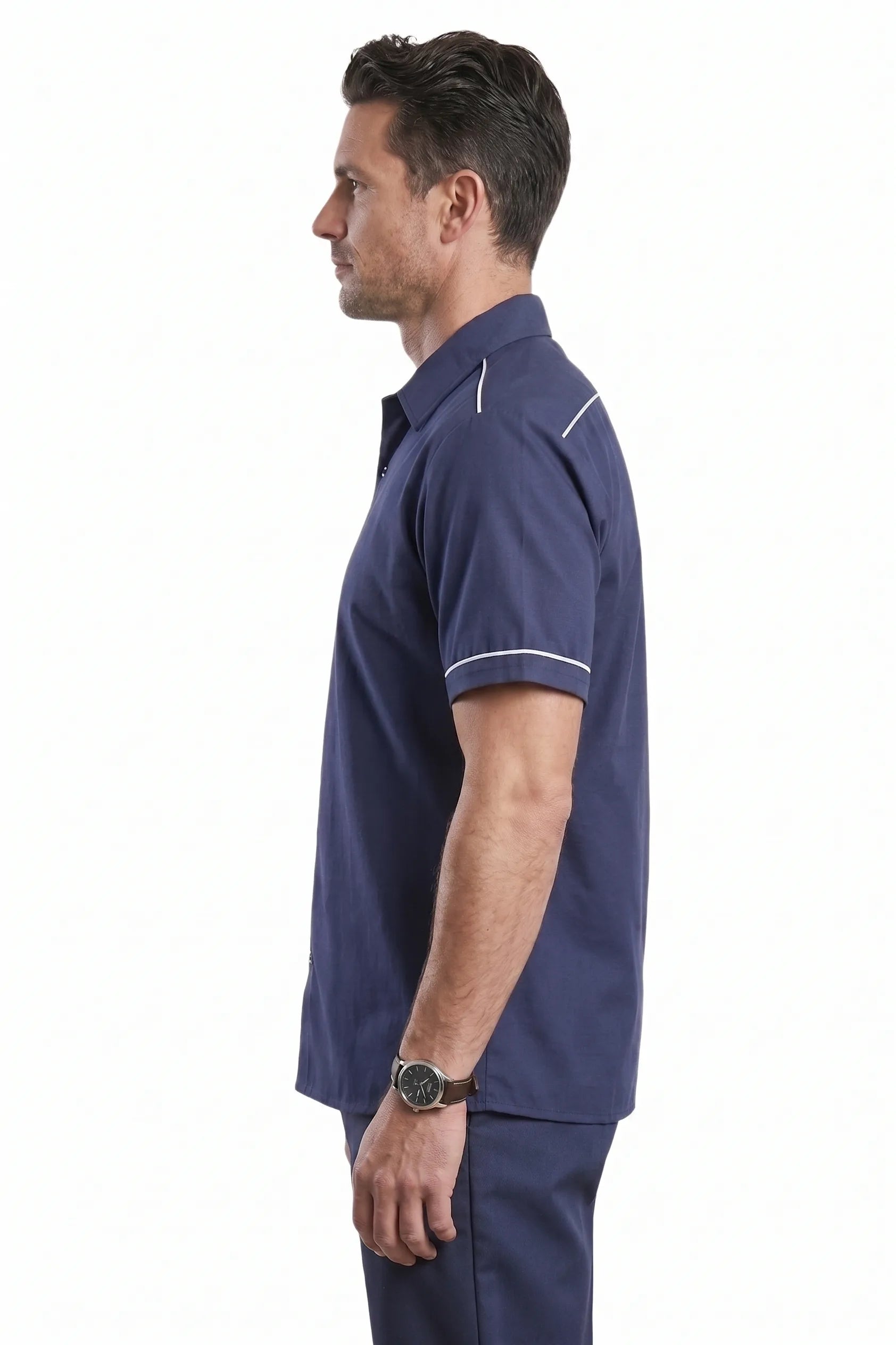 Man wearing navy Averon half sleeve workwear shirt with white piping on shoulders and sleeves, side view