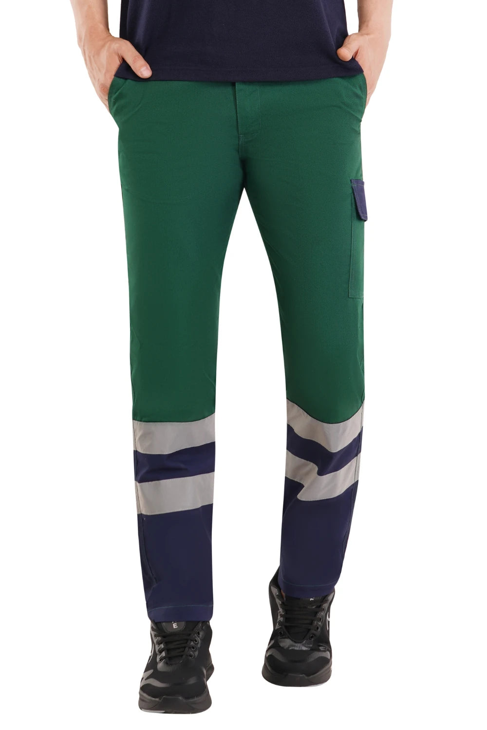 Green Atacama work pants with reflective stripes worn by a person on a white background
