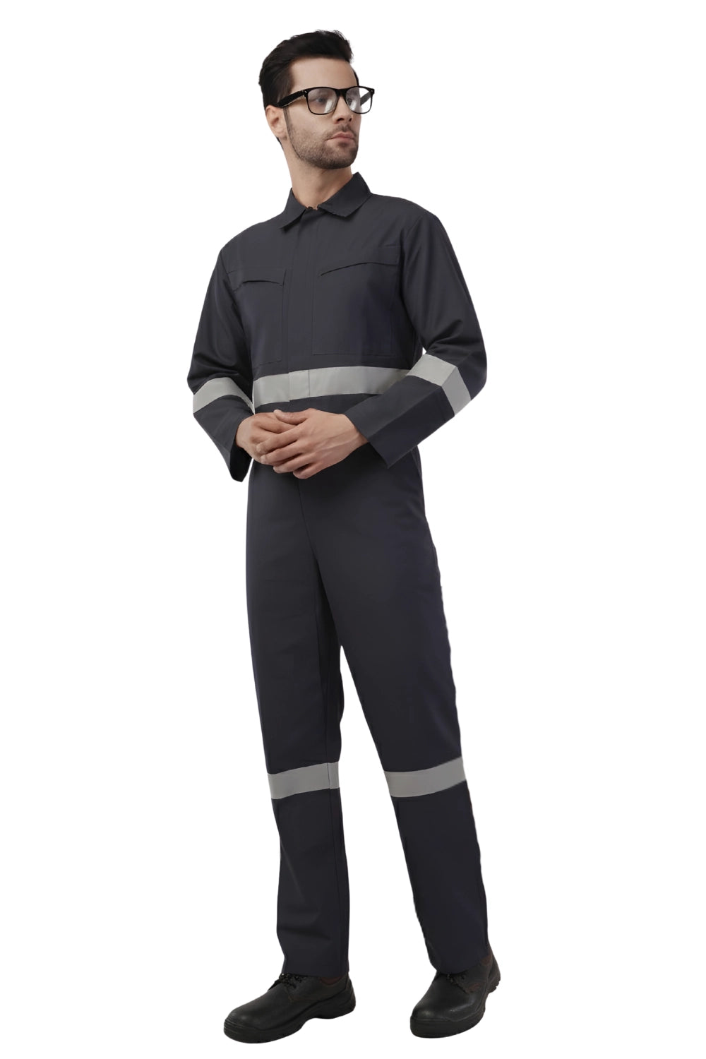 Person wearing a black work jumpsuit with reflective stripes on a white background