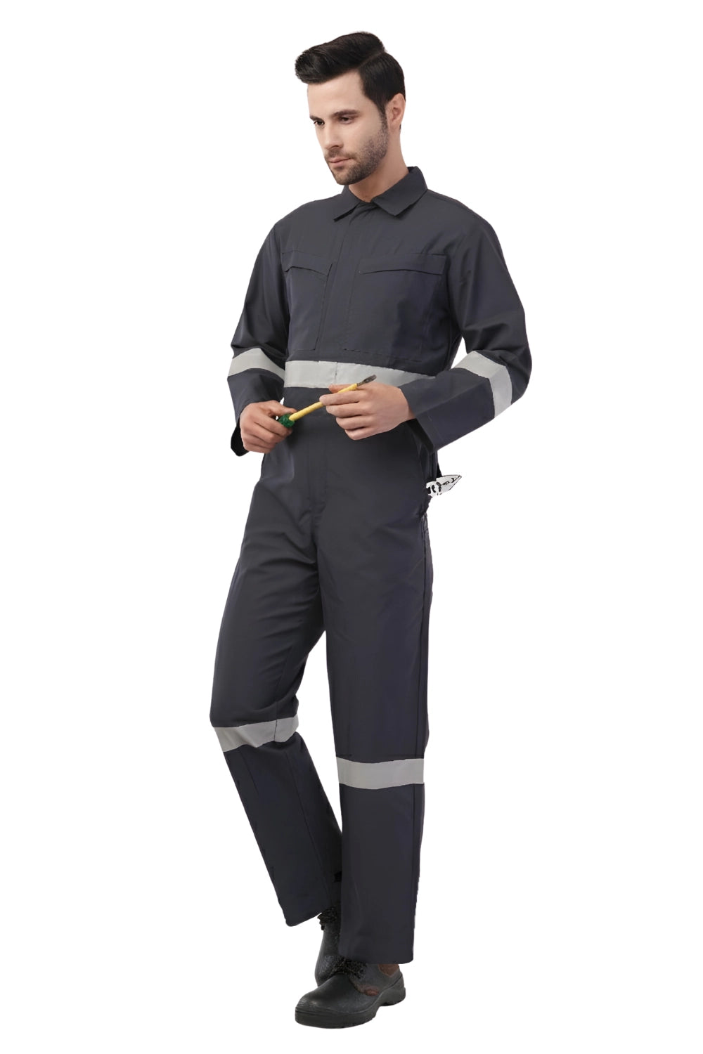 Person wearing Atacama dark blue work jumpsuit with reflective stripes on a white background