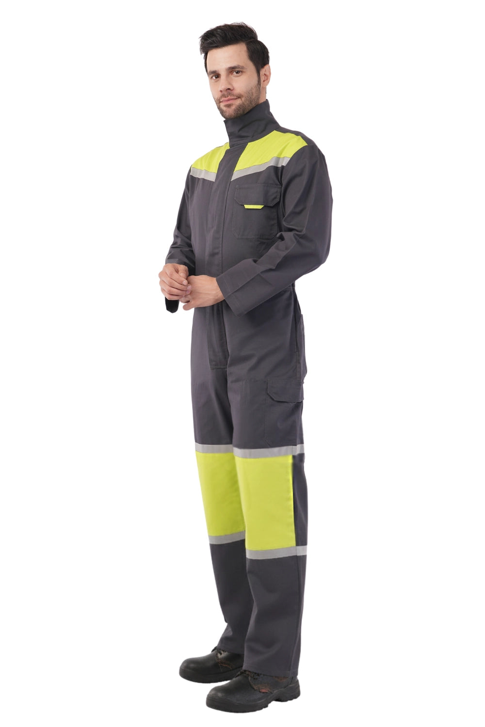 Person wearing a gray and yellow Atacama work suit on a white background