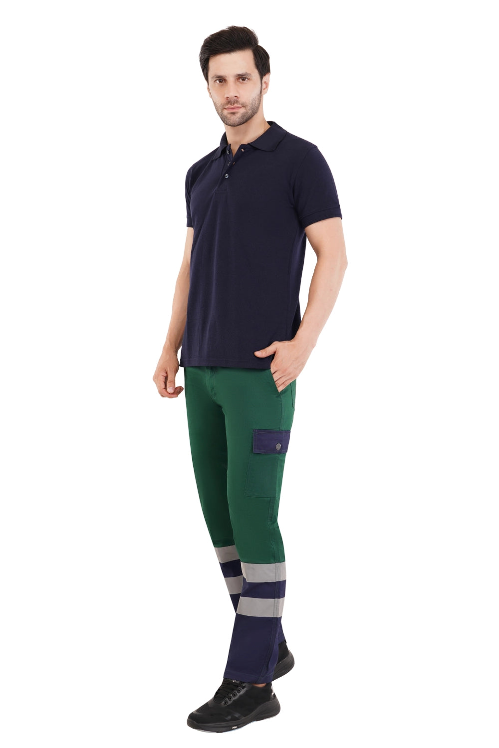 Man wearing a navy polo shirt and green high-visibility pants on a white background