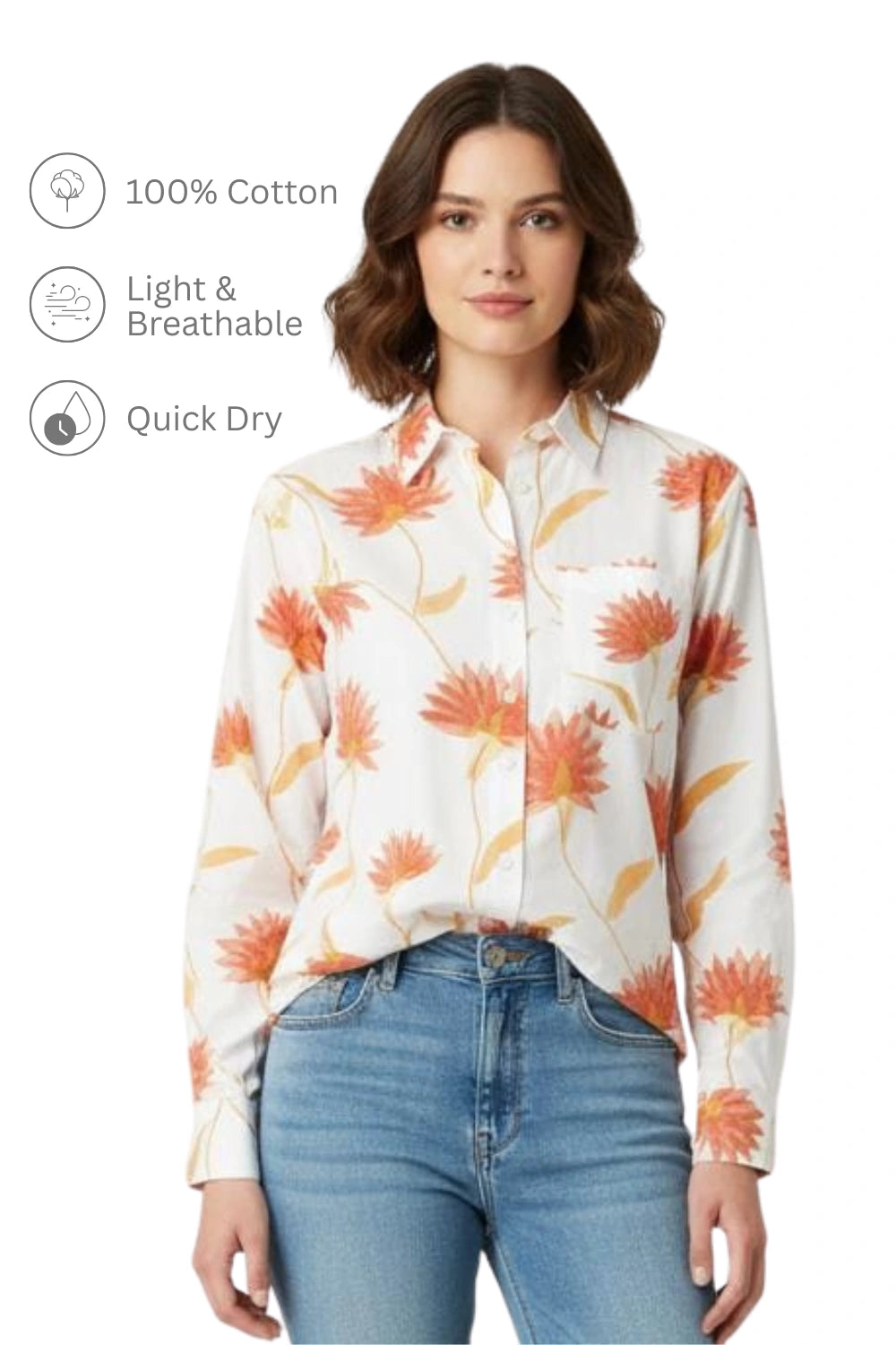 Woman wearing a white long-sleeve cotton shirt with orange floral print and front pocket, tucked into blue jeans