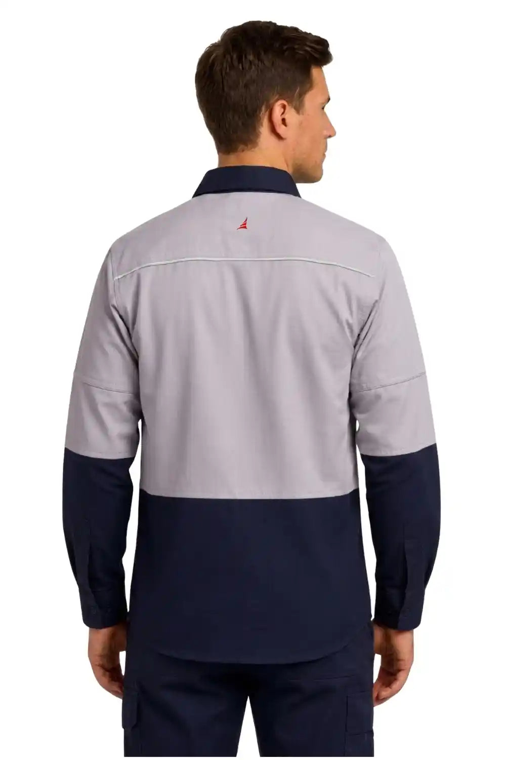 Man wearing a gray and navy long-sleeve shirt with a visible brand logo on a white background