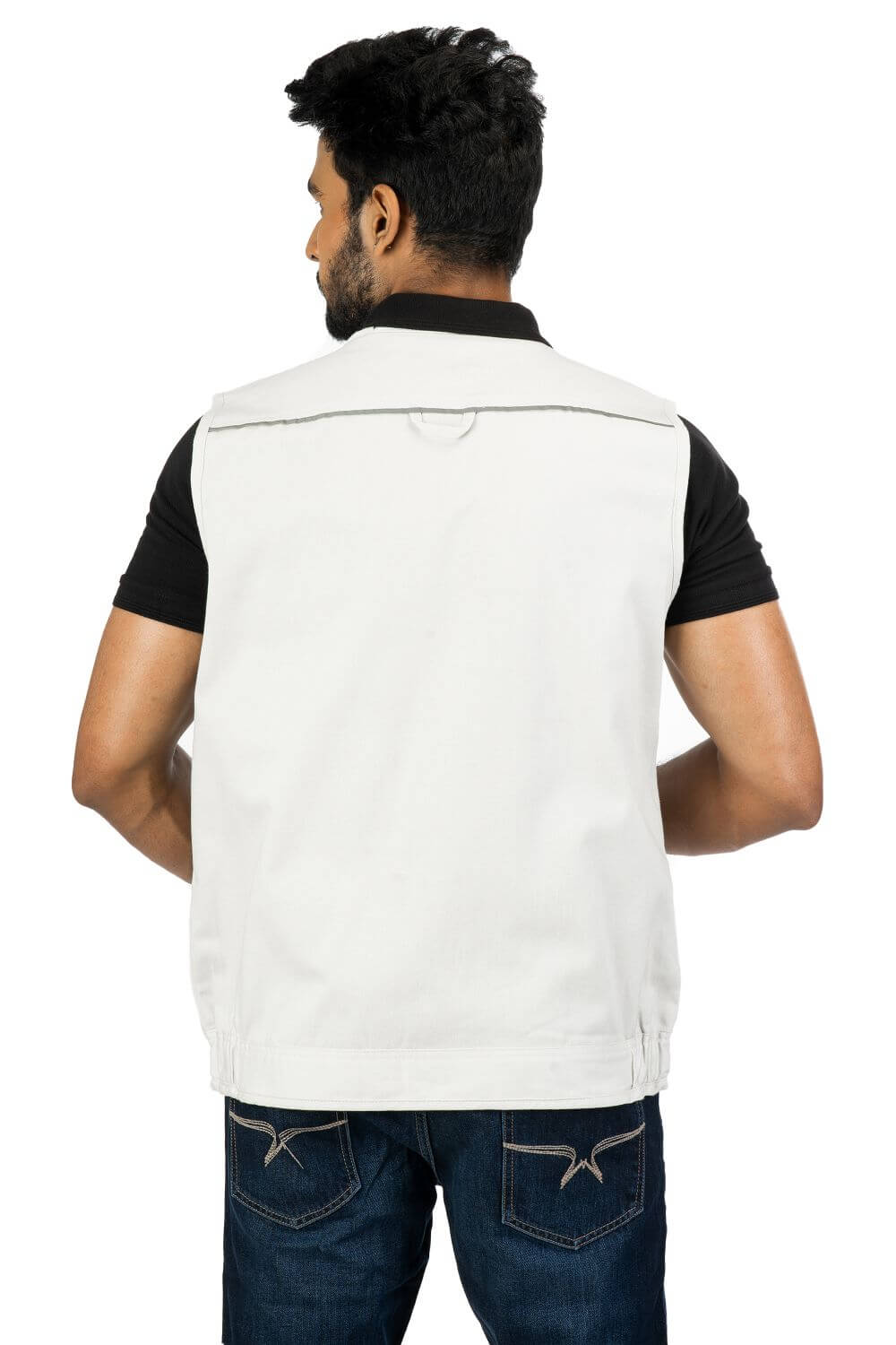Stylised mid-torso bone pockets with concealed zips. An ergonomically designed multi-utility safari Beige vest.
