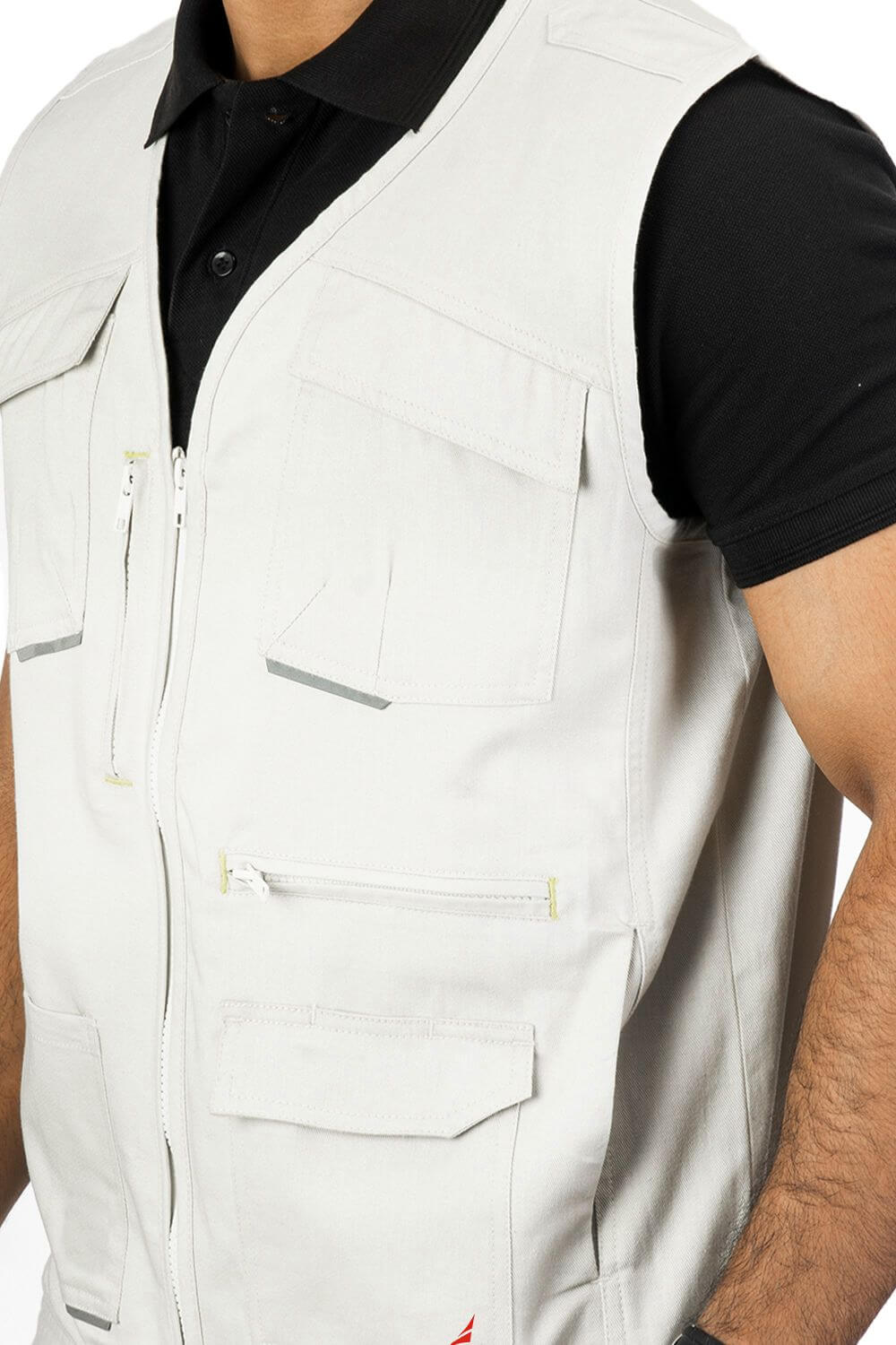 Stylised mid-torso bone pockets with concealed zips. An ergonomically designed multi-utility safari Beige vest.